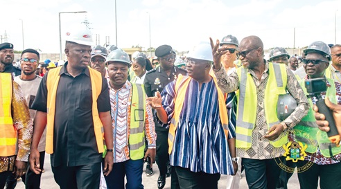 Vice-President Mahamudu Bawumia (arrowed) and Mustapha Ussif (2nd from left), the Minister of Youth and Sports, being conducted around during the tour. INSET: An aerial view of the infrastructure under construction at the Borteyman site