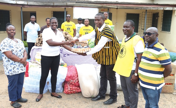 Nana Out Turkson (3rd from right), Global President, Katanga Alumni Association, handing over the food items to Francisca Ntow (2nd from left), Public Relations Officer, Accra Psychiatric Hospital. With them are Margaret Nana Aba Attah (left), Senior Nursing Officer, and members of the Katanga Alumni Association. Picture: ELVIS NII NOI DOWUONA