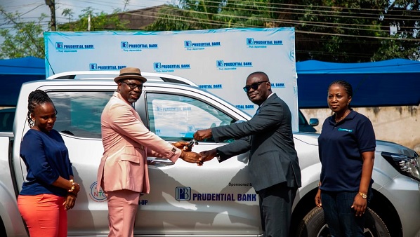 Bernard Appiah Gyebi (2nd from right) presenting keys to the vehicle to Dr Christian Addai-Poku