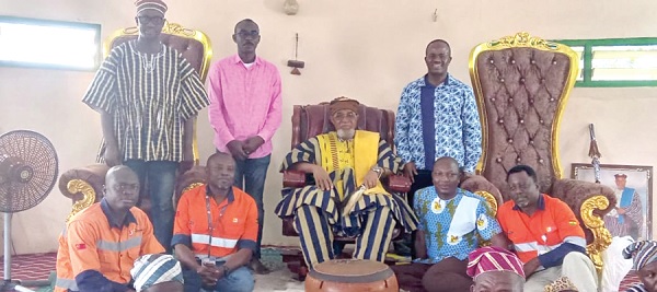 Dr Sulemanu Koney (seated right) with his team and staff of Cardinal Namdini Mining Limited, after paying a courtesy call on Tongraan Kugbilsong Nanlebegtang (seated middle), Paramount Chief of the Talensi Traditional Area