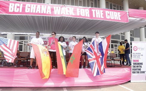 Dr Beatrice Wiafe Addai (3rd from left), Founder of Breast Care International, and members of the high table waving flags in support of breast cancer awareness,  treatment and prevention  Picture: ALBERTA MORTTY