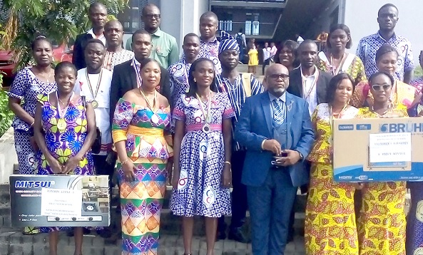 The awardees with Rev. Peter Attah Bilson (middle), the Yilo Krobo Municipal Director of Education