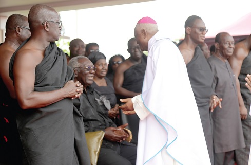 Most Rev. Joseph Afrifa Agyekum consoling former President John Agyekum Kufuor (seated) at the one-week celebration of the late Theresa Kufuor at Peduase. Pictures: SAMUEL TEI ADANO