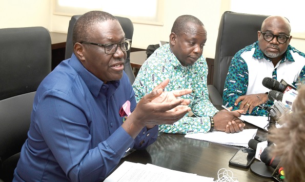 Dr Francis Kasolo (left), WHO Representative in Ghana, addressing the press conference in Accra. With him is Raphael Segkpeb (middle), Director, Innovations and Projects, NHIS