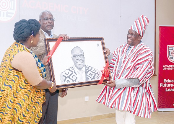 Dr Lucy Agyepong (left), Vice-President of Institutional Advancement, and Prof. Fred Mcbagonluri (middle), President and Provost of Academic City, presenting an artwork from one of the students to Alban Sumana Kingsford Bagbin, Speaker of Parliament. Picture: Caleb Vanderpuiye