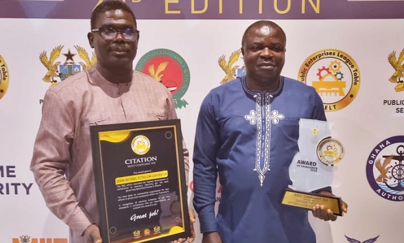 Albert Akowuah (right), Manager, Corporate Strategy, and Albert Longdon Nyewan, Deputy Manager, Compliance, with their awards