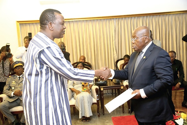  President Akufo-Addo (right) receiving letters of credence from David Kabre, Ambassador of Burkina Faso to Ghana