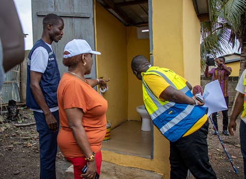 Minister of Sanitation and Water Resources, Cecilia Abena Dapaah,  inspecting one of the toilets at Ejisu in the Greater Kumasi Metropolitan Area (GKMA). With him is the National Coordinator of GAMA-SWP, George Asiedu.
