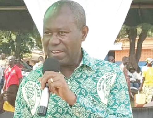 Joseph Boahen Aidoo (inset), Chief Executive Officer, COCOBOD, addressing some farmers