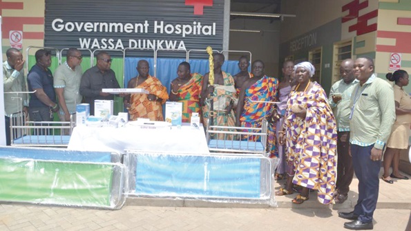 Representatives of the Wassa Dunkwa Traditional Council receiving the items from Fred Mensah Anyamesem, (4th from left), Northern Sector Manager, Republic Bank