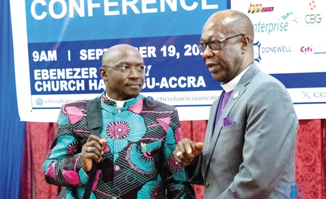 Rt Rev. Dr Hilliard Dogbe (right), Chairman of the Christian Council of Ghana, interacting with Rev. Dr Ezekiel Lesmore, Programmes Director of the All African Conference of Churches, at the ceremony