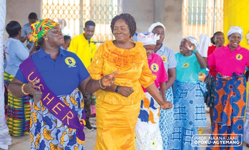 Prof. Naana Jane Opoku-Agyemang (arrowed) being ushered into the church auditorium by some members of the church.