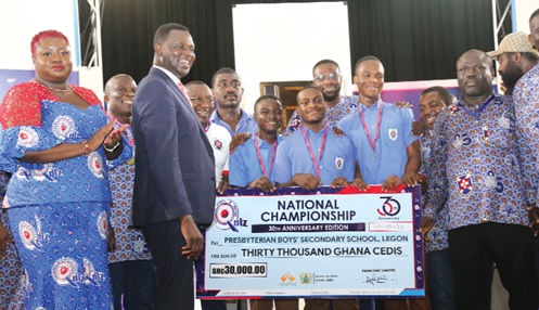 Dr Yaw Osei Adutwum (2nd from left), Minister of Education, with the winners of the 2023 National Science and Maths Quiz competition and some officials after the event. Pictures: SAMUEL TEI ADANO &  ELVIS NII DOWUONA