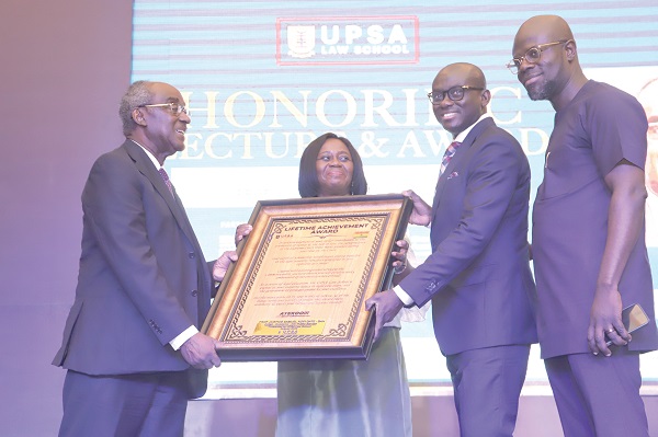 Justice Gertrude Araba Torkonoo (2nd from left), Chief Justice, Prof. Kofi Abotsi (right), Dean, UPSA Law School, and Godfred Yeboah Dame (2nd from right),  Minister of Justice and Attorney-General, jointly presenting a citation to Prof. Samuel Kofi Date-Bah (left). Picture: SAMUEL TEI ADANO