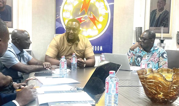 Edward Boateng (2nd from left), Director-General of the State Interests and Governance Authority, holding discussions with Samuel Dubik Mahama (3rd from left), Managing Director of ECG. With them are some management staff of SIGA and ECG 