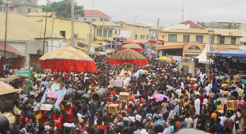 A retinue of chiefs in a procession through the principle streets of Cape Coast