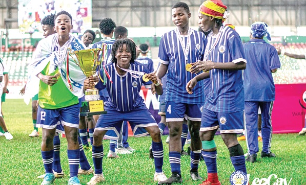 Some players of Ampem Darkoa Ladies celebrating with the WAFU Cup trophy