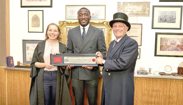 Emmanuel Nii Odartey Lamptey (middle), Freedom of The City of London awardee with two Chamberlains of the City of London Corporation.