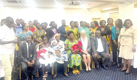 Some of the beneficiary mothers with their babies and participants in the dissemination workshop in Accra. With them is Prof. Jody Lori (2nd from right) of the University of Michigan