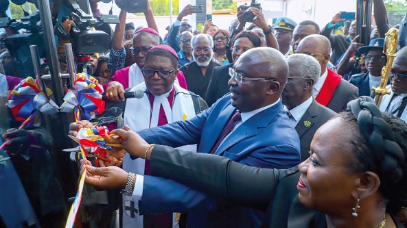 Vice-President Mahamudu Bawumia cutting the tape to inaugurate the new head office of the Methodist Church Ghana. With him are Most Rev. Dr Paul K. Boafo, (left),  Presiding Bishop of the Methodist Church Ghana, Justice Gertrude Torkornoo (right), the Chief Justice, and other dignitaries.  INSET: The new head office complex of the Methodist Church Ghana­