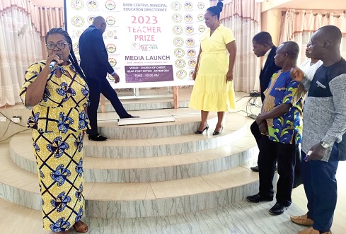 Esther Quaye-Sowah (left), the Birim Central Municipal Director of Education, launching the Teacher Prize award. With her on the right are the award committee members