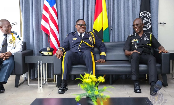 The Inspector-General of Police (IGP) of the Liberia National Police, Gregory O. W. Coleman, (2nd left) with IGP Dr Akufo-Dampare (right)
