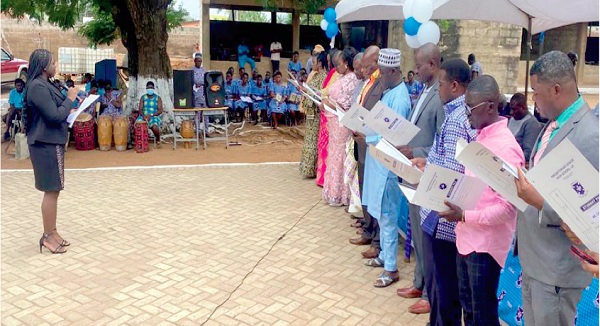 Adwoa Benaso ASumadu Sakyi, a District Court Judge, swearing in members of the board