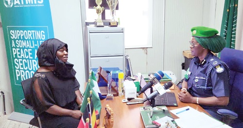 Emelia Ennin Abbey (left), Staff Writer, Daily Graphic, in the interview with Police Commissioner Hillary Sao Kanu, ATMIS Force Commander