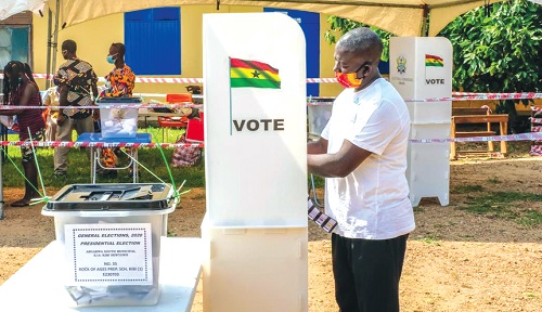A voter at the polling station casting his vote