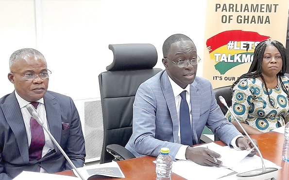 Cyril Nsiah (middle), Clerk-to-Parliament, addressing the press. With him are Ebenezer A. Directror (left), acting Deputy Clerk, and Gloria Sarku Kumawu, Chief Information Officer of Parliament