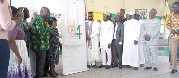 The invited guests unveiling the anniversary logo