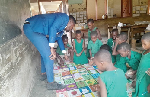 William Edward (left), a teacher of the EP Primary at Donkorkrom, taking Mathematics Level two learners through differentiated learning William Edward (left), a teacher of the EP Primary at Donkorkrom, taking Mathematics Level two learners through differentiated learning