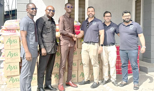 Bernard Avle (3rd from left), host of Citi FM's Breakfast Show, exchanging pleasantries with Puneet Gidwani, the Director of DPS Group, at the presentation ceremony