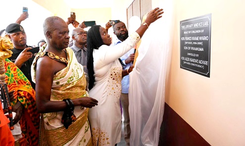 Sandra Opoku (in front), Daughter of the late MP, unveiling the plaque of the facility while Barima Owusu Amo Ameyaw (2nd from left), Chief of Pramkuma, and other dignitaries look on