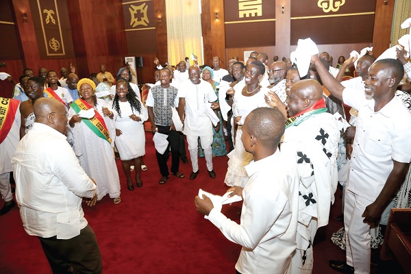  President Akufo-Addo (left) dancing with cocoa farmers at the Jubilee House. Picture: SAMUEL TEI ADANO