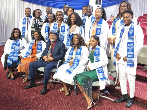The writer (seated middle) with newly inducted doctors from Accra College of Medicine
