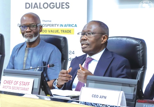 Silver Ojakol l (right), Chief of Staff, AfCFTA, addressing the press conference in Accra. With him is Gabby Asare Otchere-Darko, Executive Chairman of APN