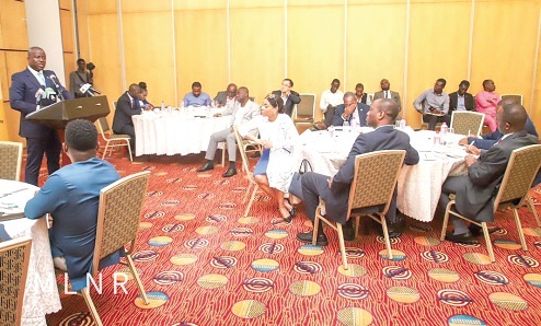 Samuel Abu Jinapor (left), Minister of Lands and Natural Resources, addressing the participants 
