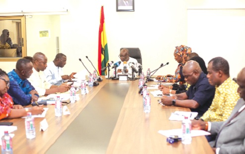 Ken Ofori-Atta (head of table), Minister of Finance, addressing participants in the press conference