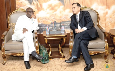 Ken Ofori-Atta (left), Minister of Finance, in a discussion with Lu Kun, the Chinese Ambasador to Ghana, at the meeting in Accra