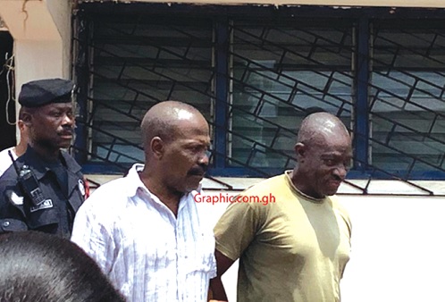 Colonel Samuel Kojo Gameli (middle ) and Gershon Akpa being escorted from the court