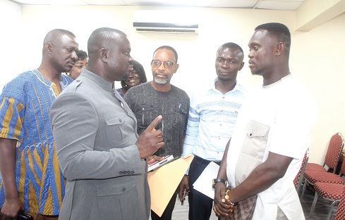 Albert Kwabena Dwumfour (2nd from left), President, GJA, interacting with David Kobenna (right), victim of the assault. With them is Kingsley Nana Buadu (3rd from right), Central Regional Secretary, GJA, and some executive members of the association. Picture: ESTHER ADJORKOR ADJEI