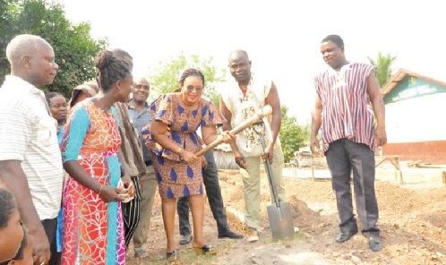 Juliana Kpedekpo (arrowed), Adaklu DCE, performing the sod-cutting