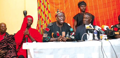 Osabarima Agyare Tanadu II flanked by his linguist to his right and Nkrabea Effah Darteh (left), his lawyer, addressing the press conference