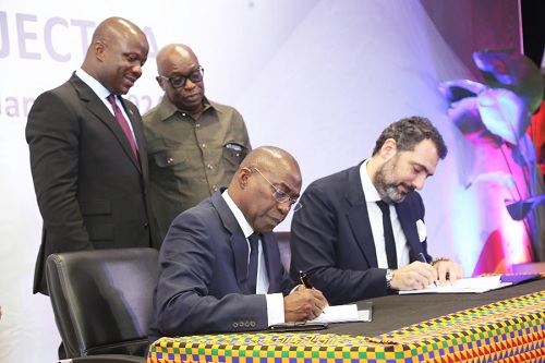 Elenos Karaindros (right), Chief Strategy and M & A, Mytilineos Energy and Metals, and Michael Ansah (left), CEO, Ghana Integrated Aluminium Development Corporation (GIADEC), signing the MoU in Accra. With them are Samuel Abu Jinapor (left) and Dr Oteng Gyasi (standing right), Board Chairman, GIADEC. Picture: SAMUEL TEI ADANO