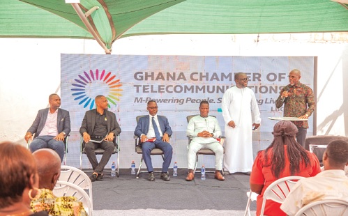 Kwaku Sakyi Addo (right), one of the judges for the Telecom Media Excellence Awards, making a submission at the Dialogue while Dr Ken Ashigbey (2nd from right), CEO of the Telecom Chamber, looks on