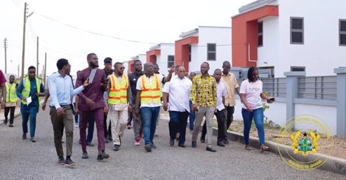 Mr Oppong Nkrumah (arrowed) in the company of some staff of the ministry, inspecting some of the housing units