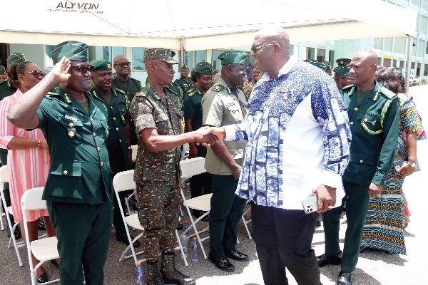Henry Quartey (2nd from right), Minister for the Interior, exchanging pleasantries with some officers of the Ghana Immigration Service. Behind him is Kwame Asuah Takyi (right), Comptroller-General of the GIS