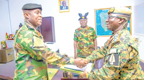 Brigadier General Matthew Essien (right),  outgoing GOC of the Northern Command,  handing over to Brigadier General Frank Nartey Tei, the new GOC, in Tamale
