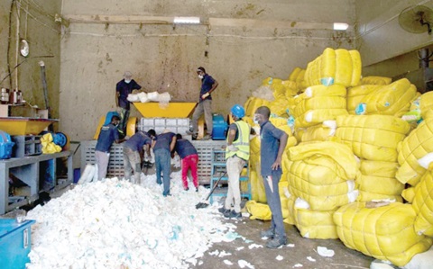 Officials of the FDA supervising the destruction of the seized diapers